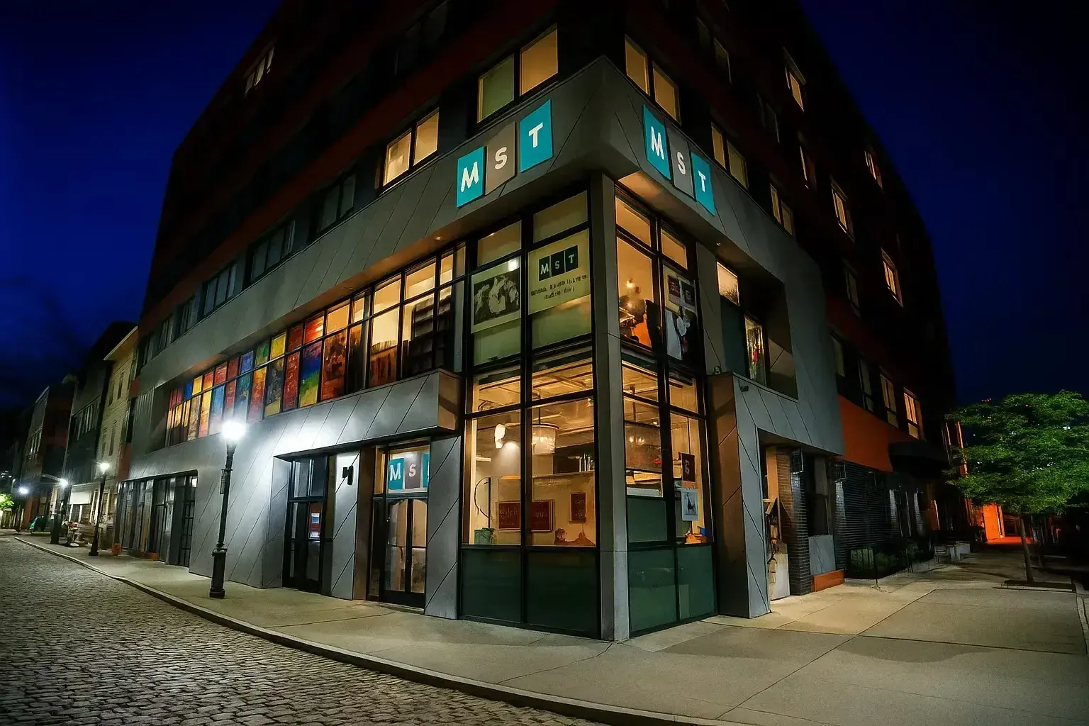 Mile Square Theatre exterior at night with its illuminated corner marquee.