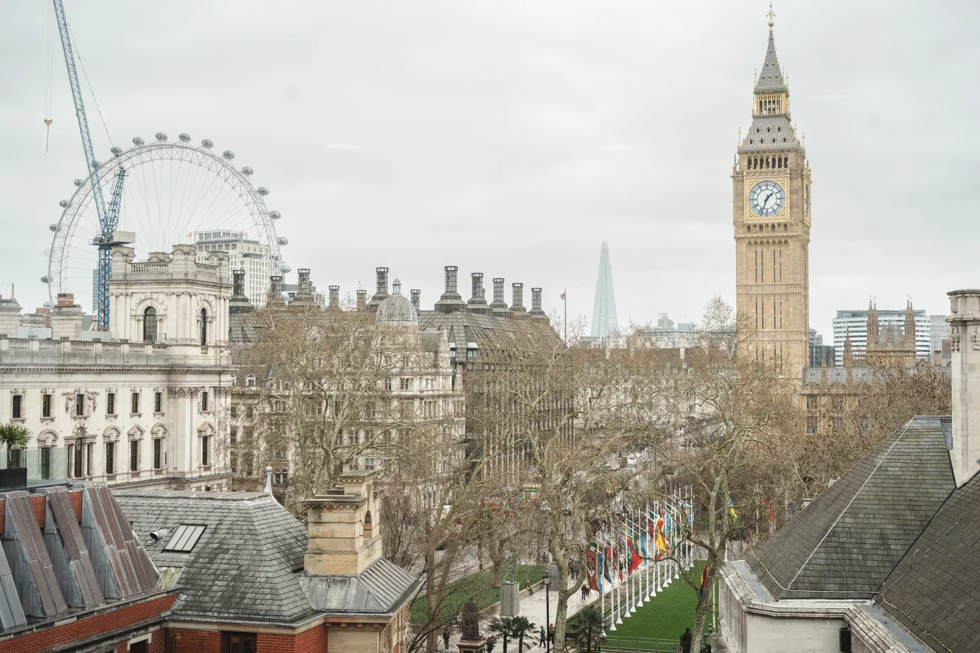 View from the QEII Centre toward Big Ben, the London Eye, and Westminster rooftops.